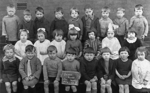 Sacred Heart Infants Tony Kilroy Third  from Right Front Row 1924 Restored.webp