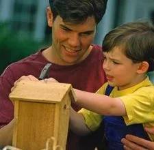 dan and son with birdhouse.webp