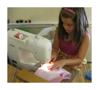 LittleGirl Sewing.webp